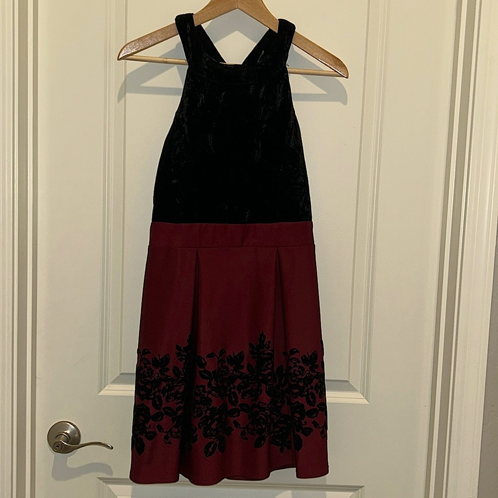Burgundy with black velvet dress. Worn once. I’m pictured in it.